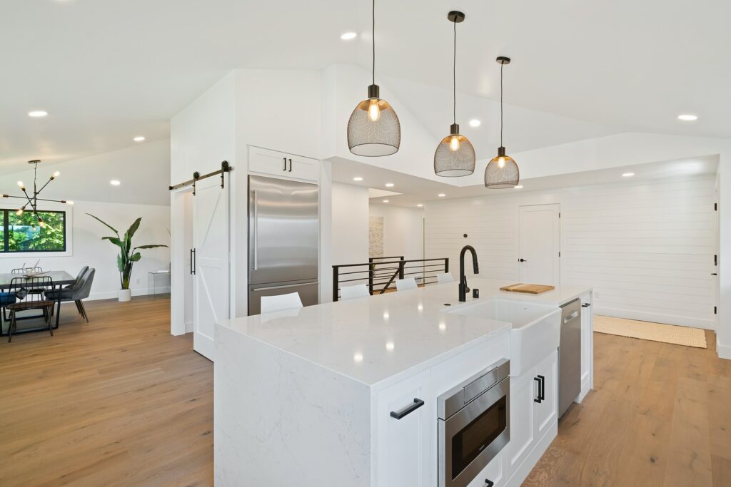 turned on pendant lamps above kitchen island