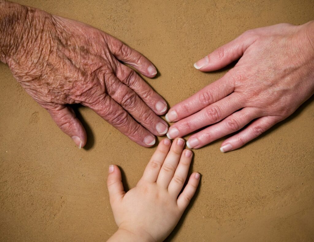 sandwich generation; three hands together